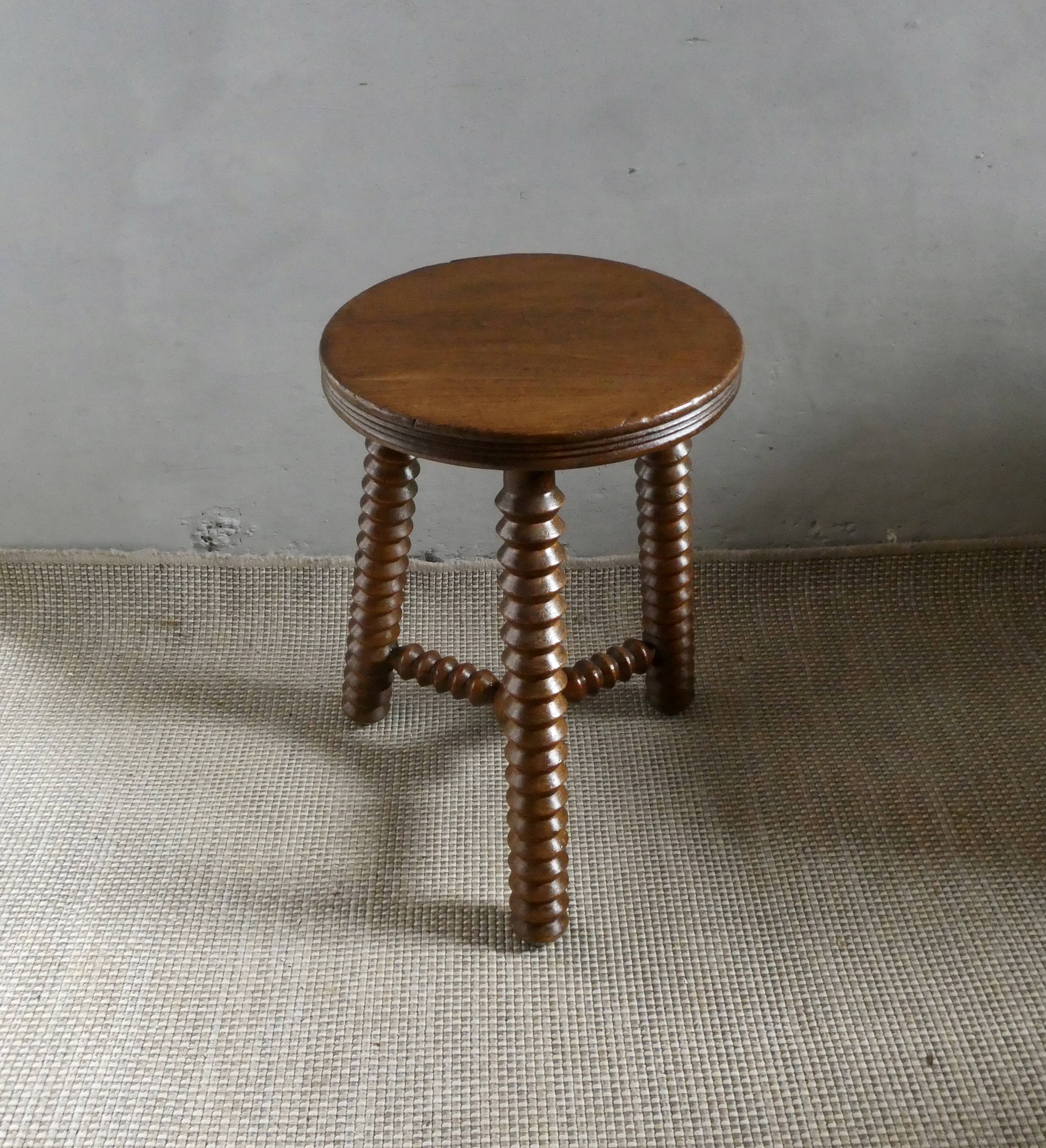 Tripod stool, with carved legs, around 1940