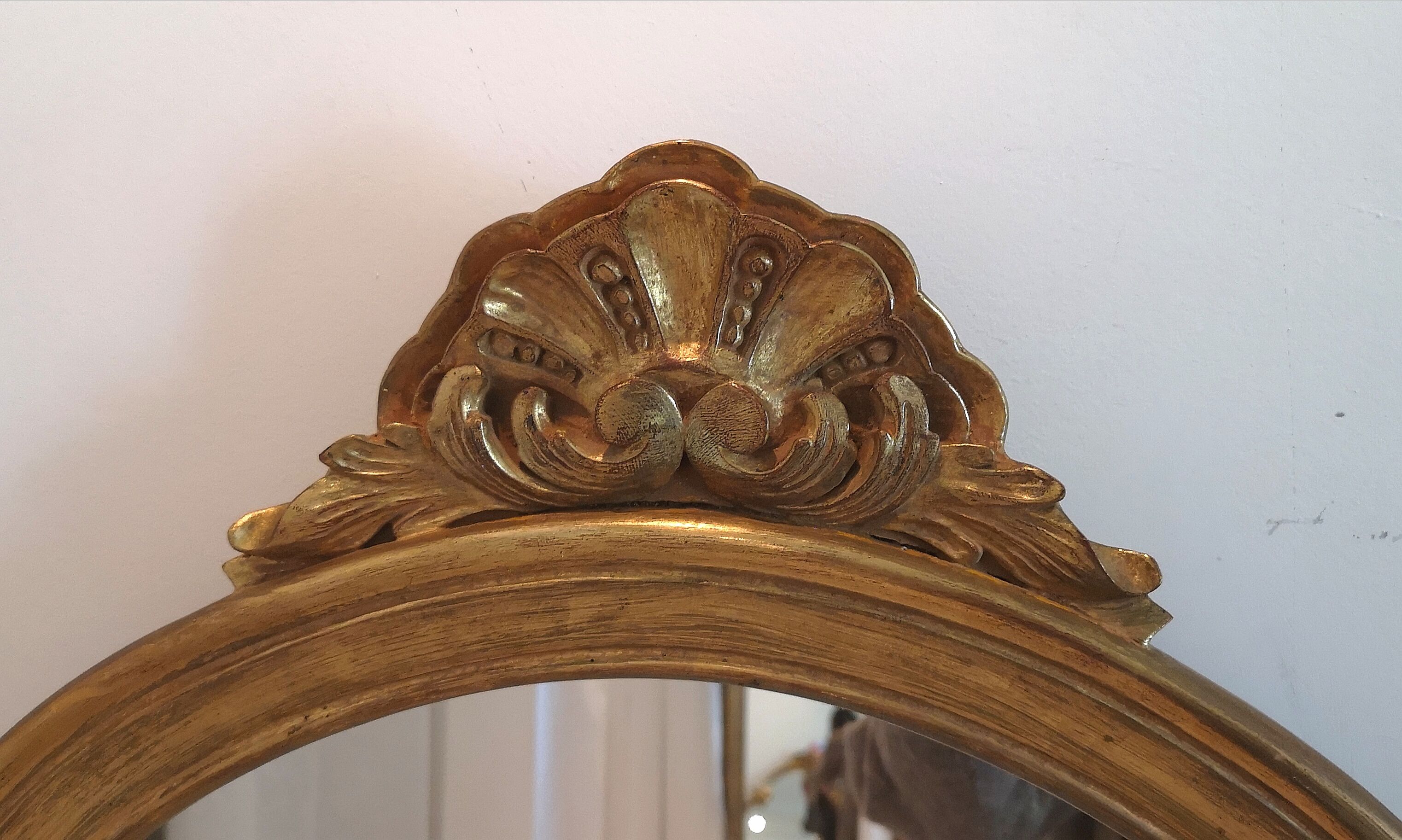 Elongated oval baroque gilded mirror