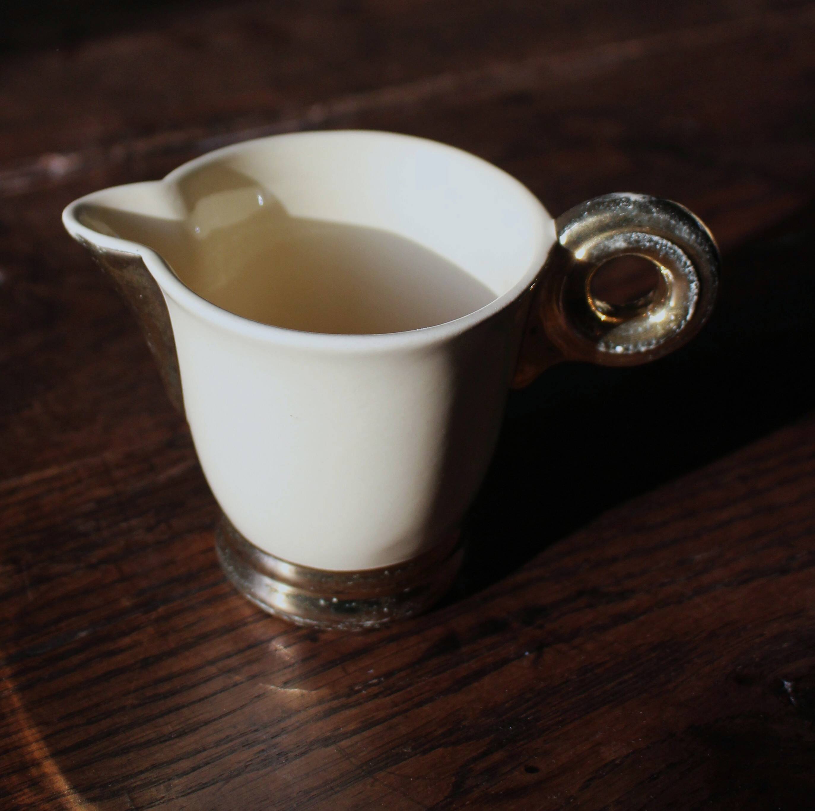 Ecru ceramic milk jug with gold decoration from Sarreguemines.