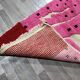 Handmade pure wool rug in pink, size 150 x 250 cm.