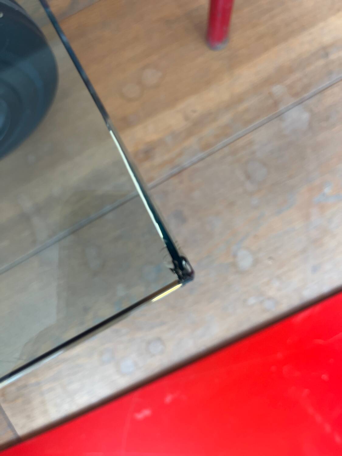 Gae Aulenti coffee table for Fontana Arte, transparent glass top with black cast iron supports, 1980s.