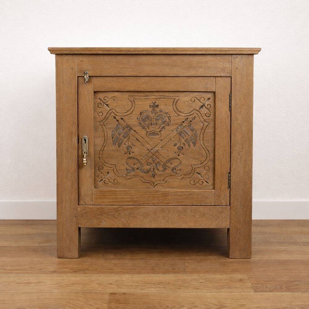 Oak side cabinet with carved motifs