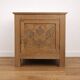 Oak side cabinet with carved motifs