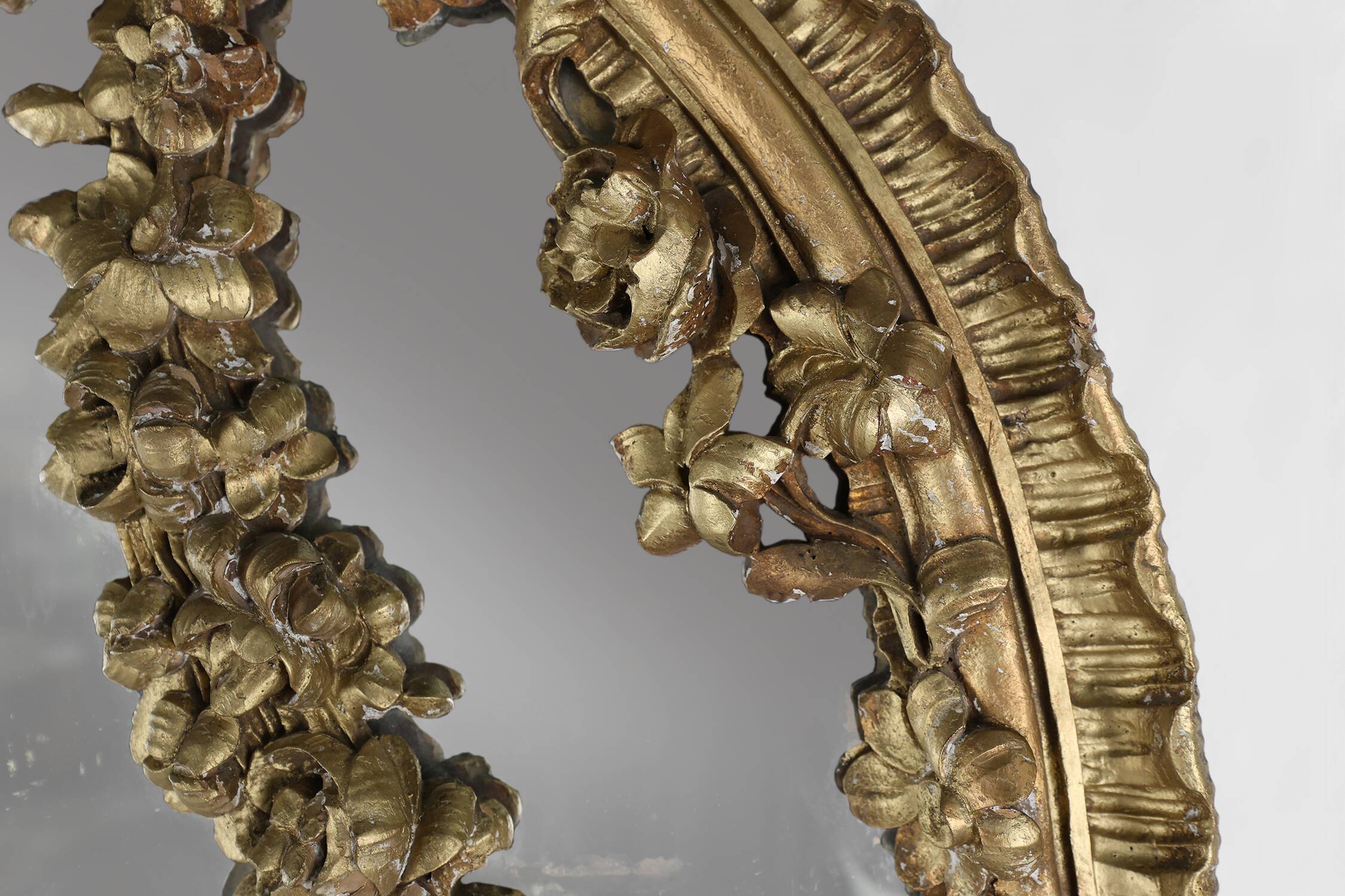 Large baroque decorated chimney mirror in gilted wood, France ca. 1800