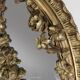 Large baroque decorated chimney mirror in gilted wood, France ca. 1800