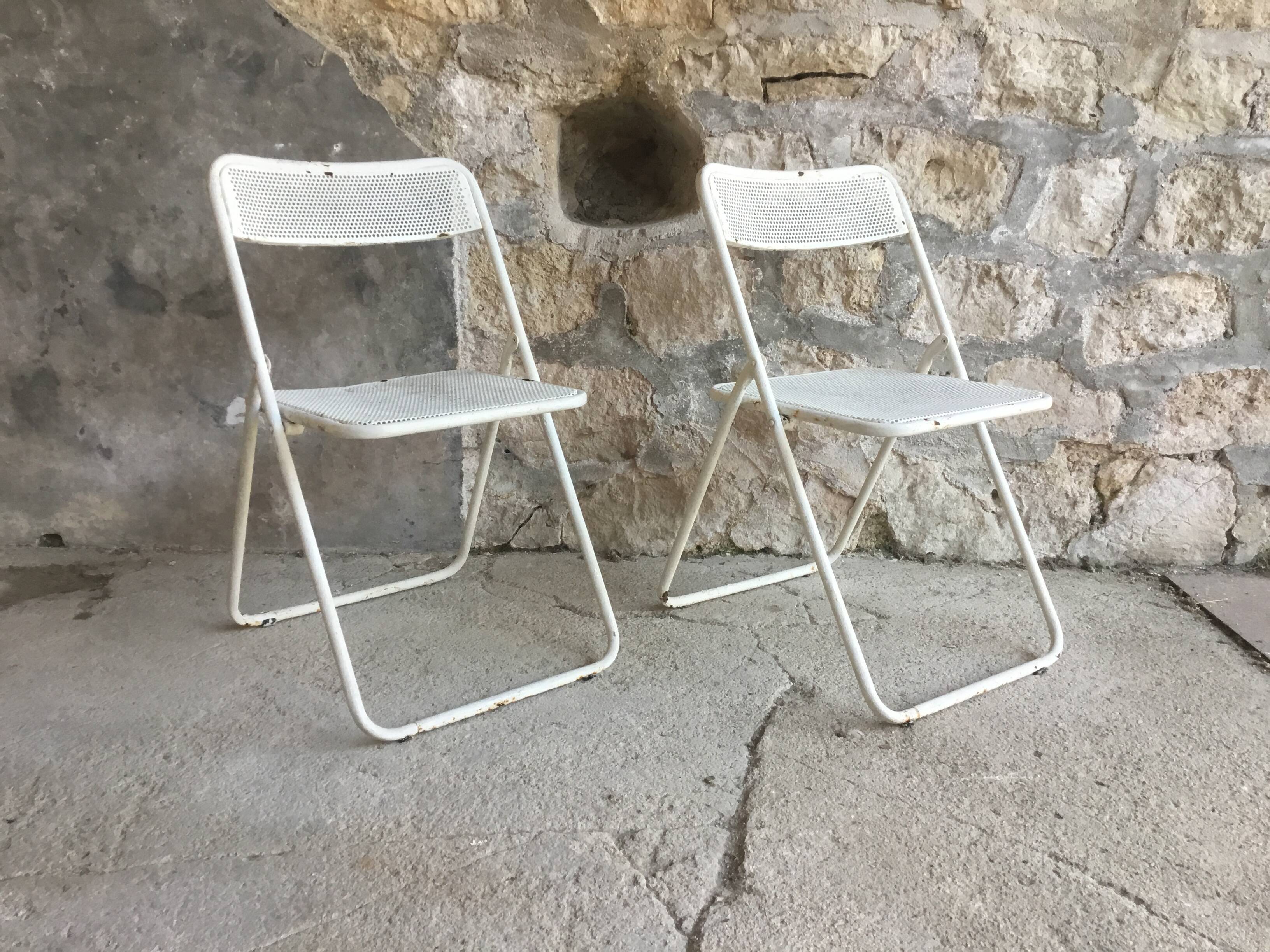 Pair of white perforated metal folding chairs - vintage