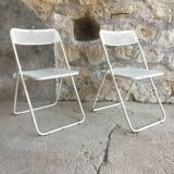 Pair of white perforated metal folding chairs - vintage