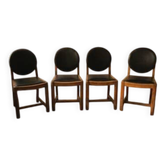 Set of four vintage wooden dining chairs with black leather upholstery