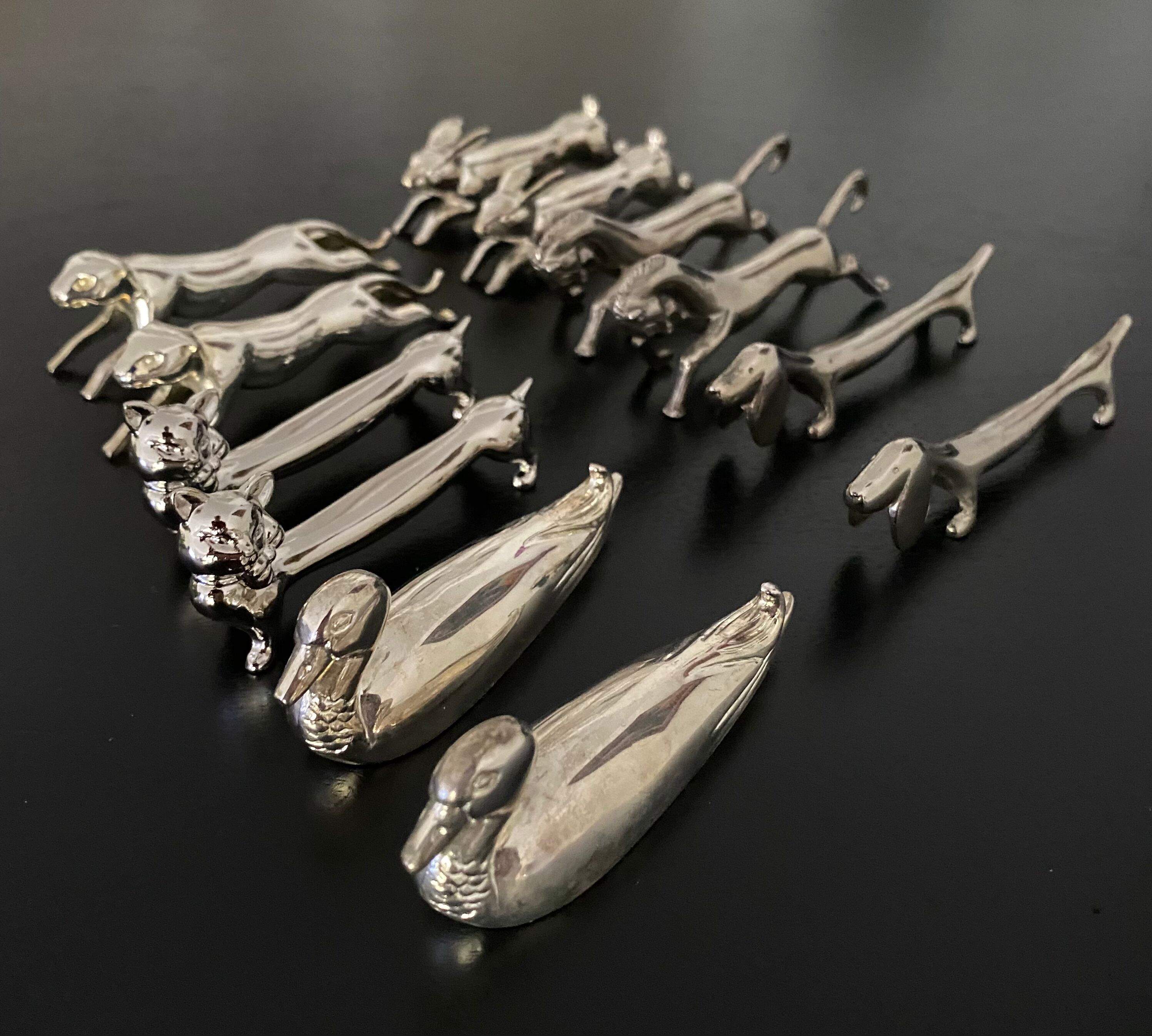12 knife holders form various metal animals
