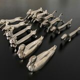 12 knife holders form various metal animals