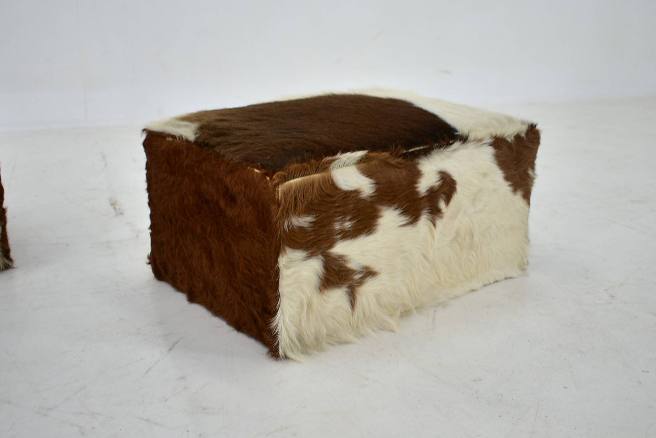 red brown leather cowhide footstools , poufs, 80s