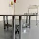 Round coffee table in smoked glass and chrome steel, 1970s design.