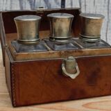 Antique leather case with 3 beveled bottles