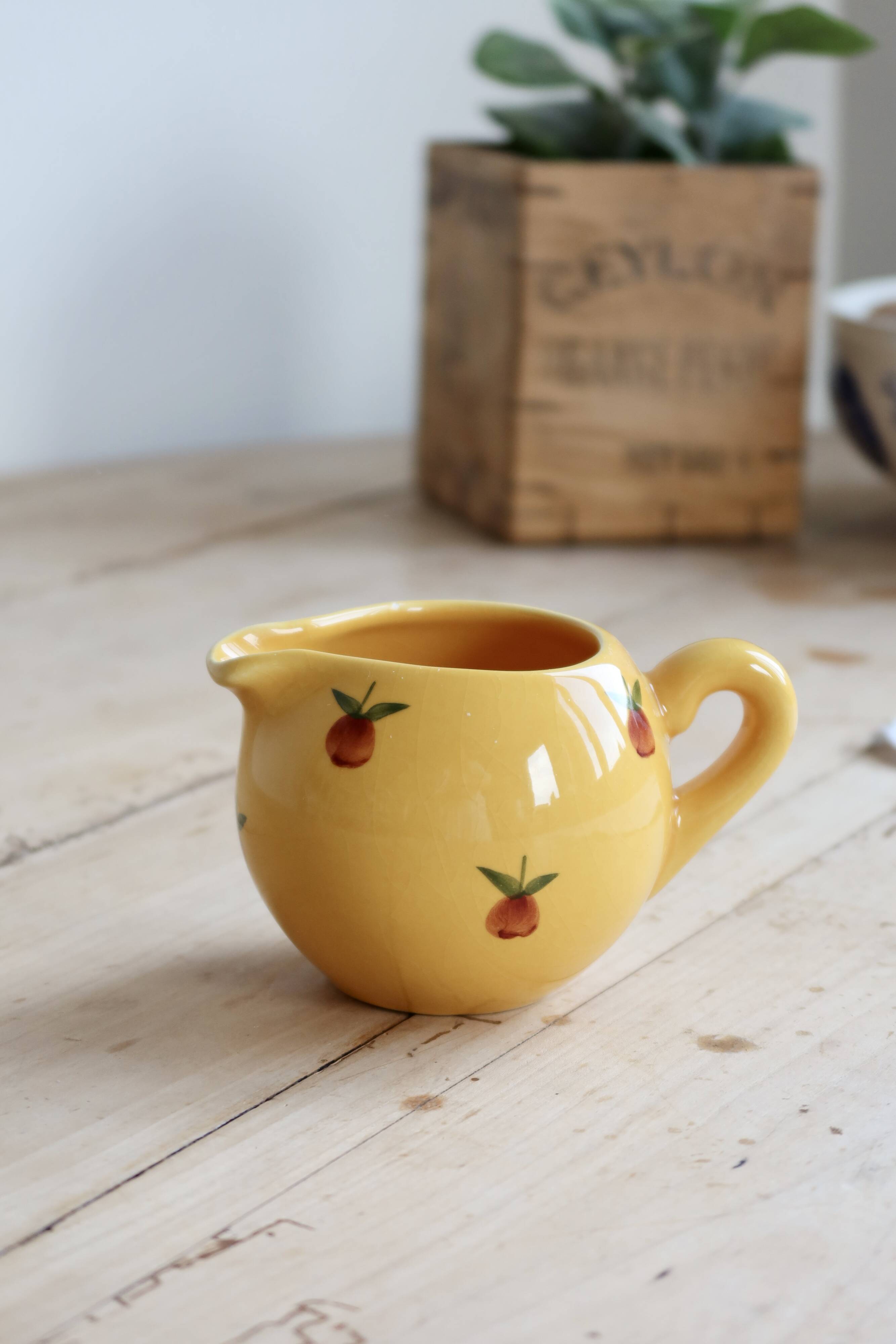 Vintage yellow ceramic milk jug