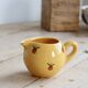 Vintage yellow ceramic milk jug