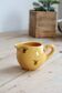 Vintage yellow ceramic milk jug