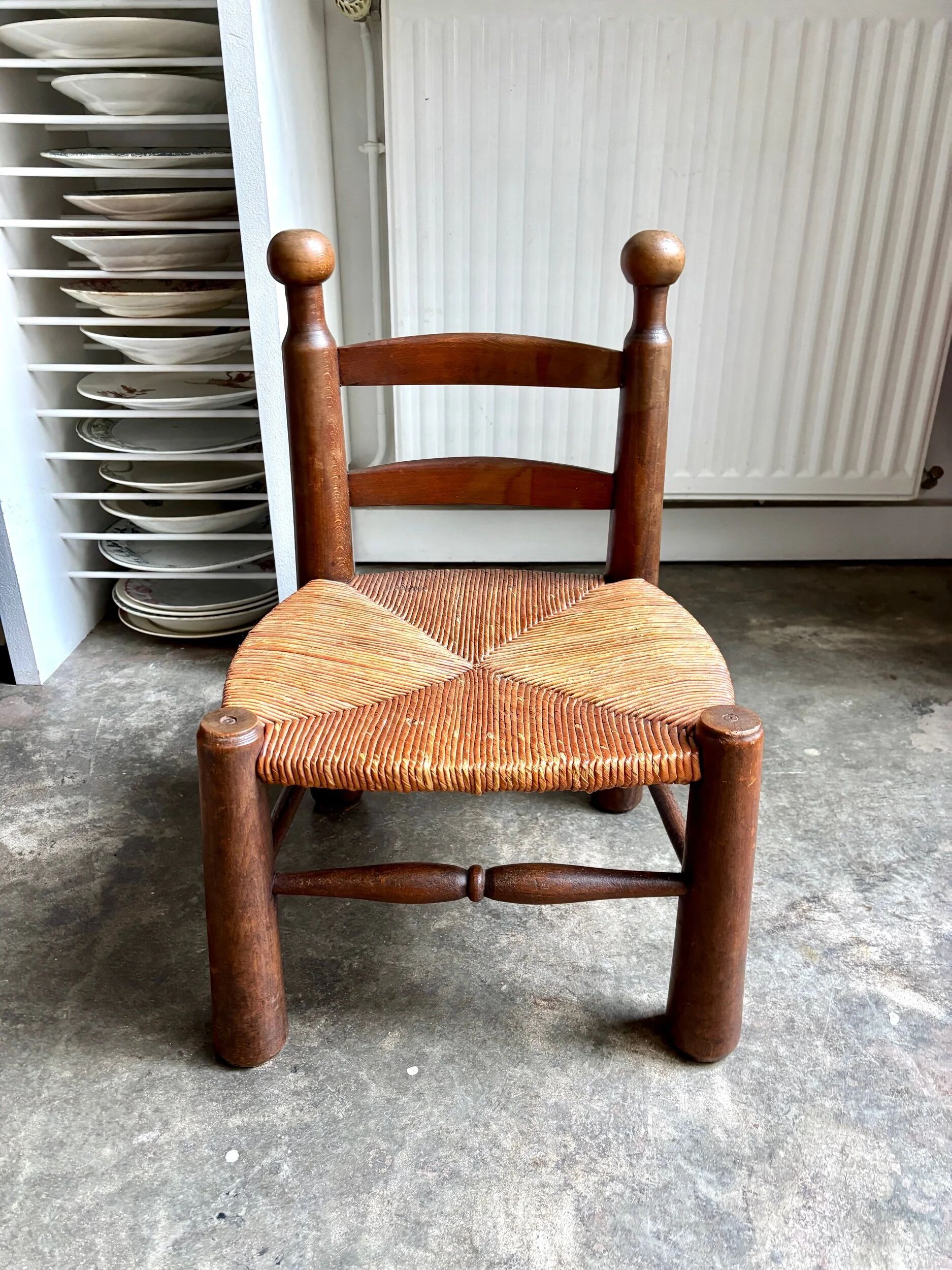 Low brutalist chair in dark wood and straw no. 2