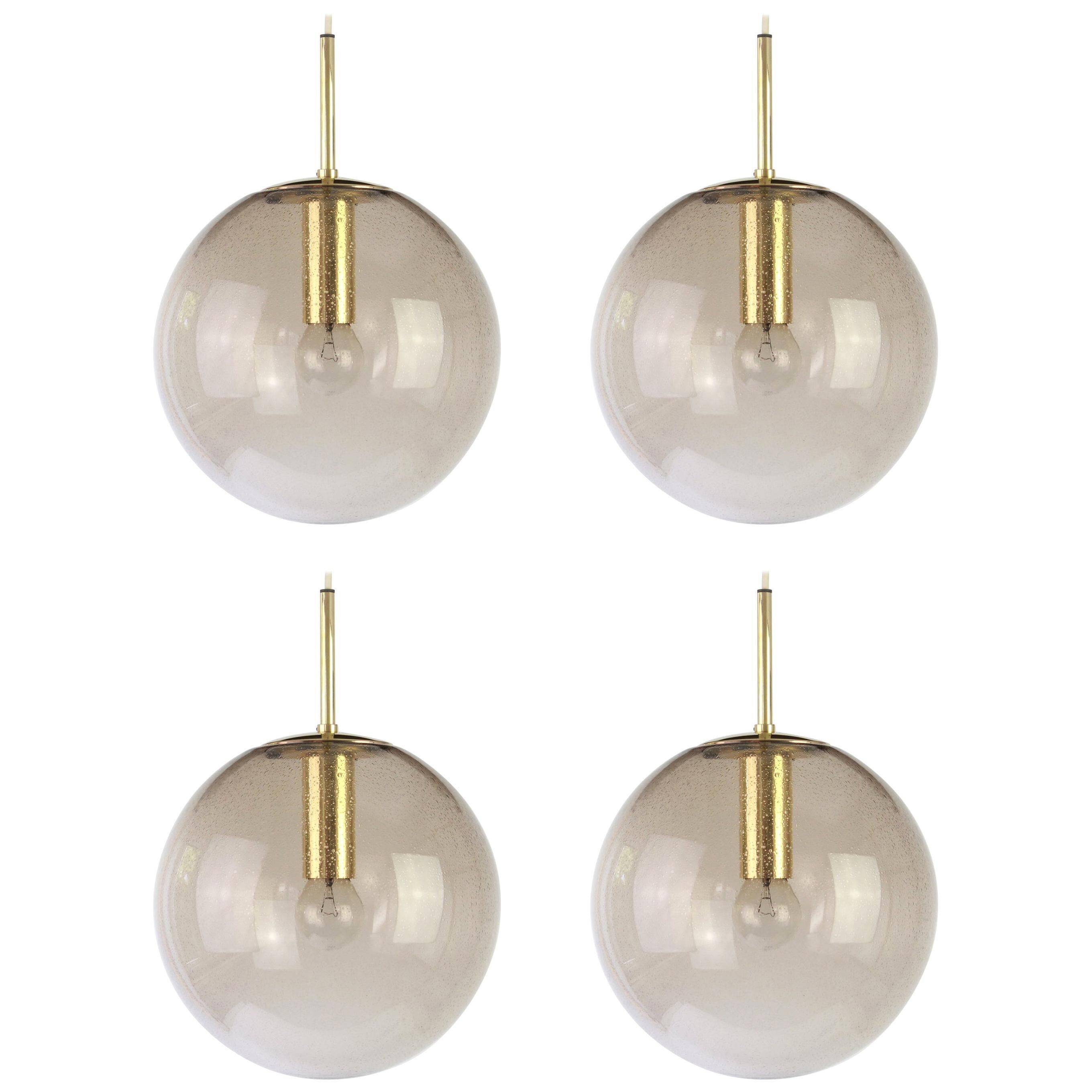 Smoked glass and brass ball pendant light Limburg, Germany, 1970s
