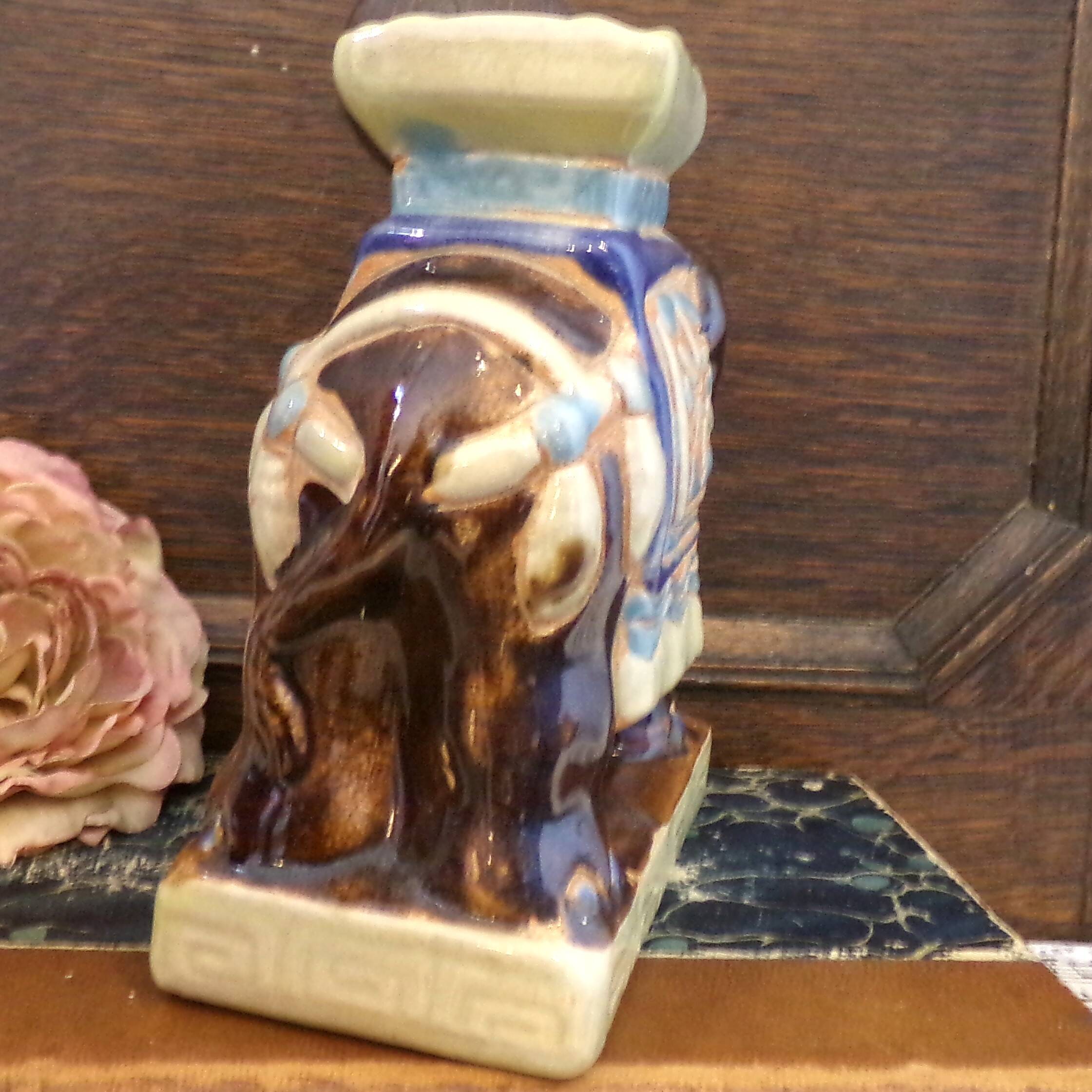 Small brown ceramic elephant vase