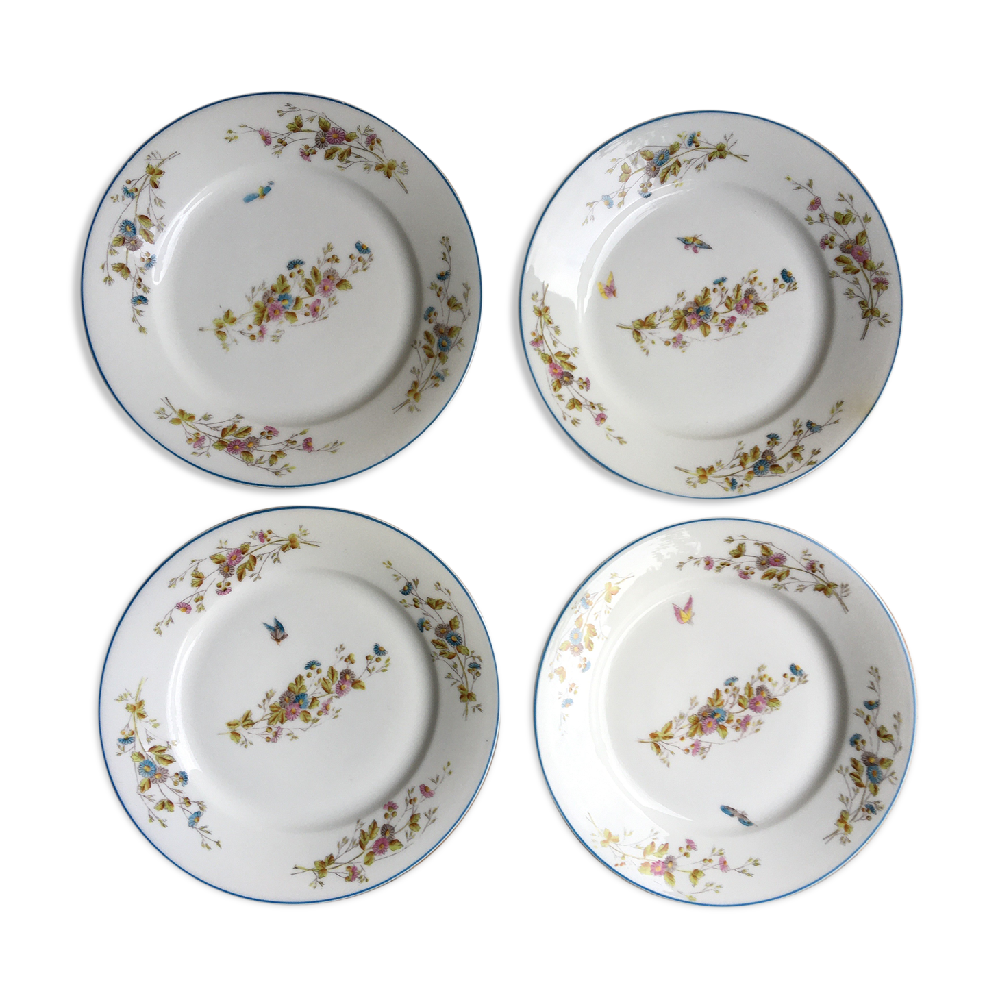 4 assiettes en porcelaine papillons