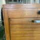 1950s oak office storage cabinet with curtains.