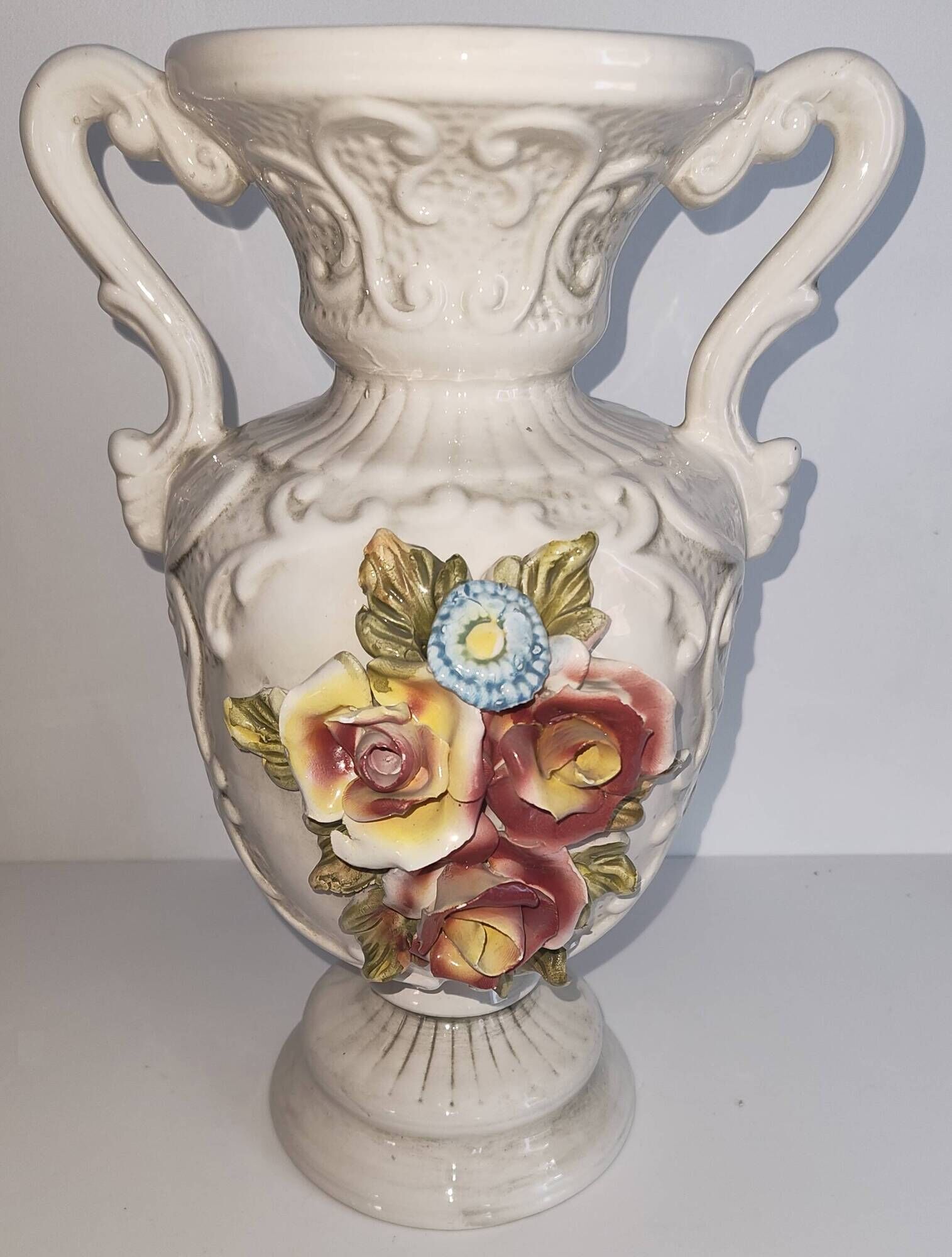 Vintage Italian white ceramic vase with raised floral decoration.