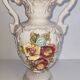 Vintage Italian white ceramic vase with raised floral decoration.