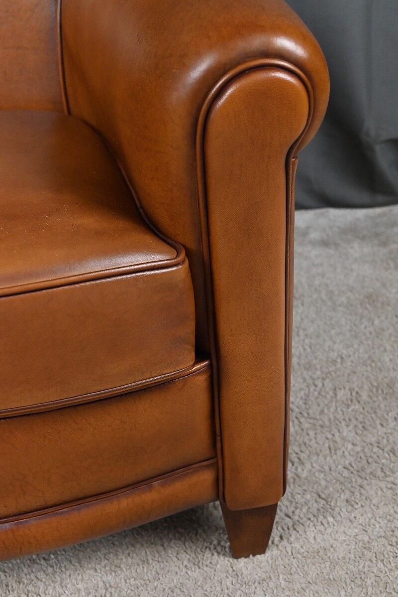 Paire de fauteuils club en cuir