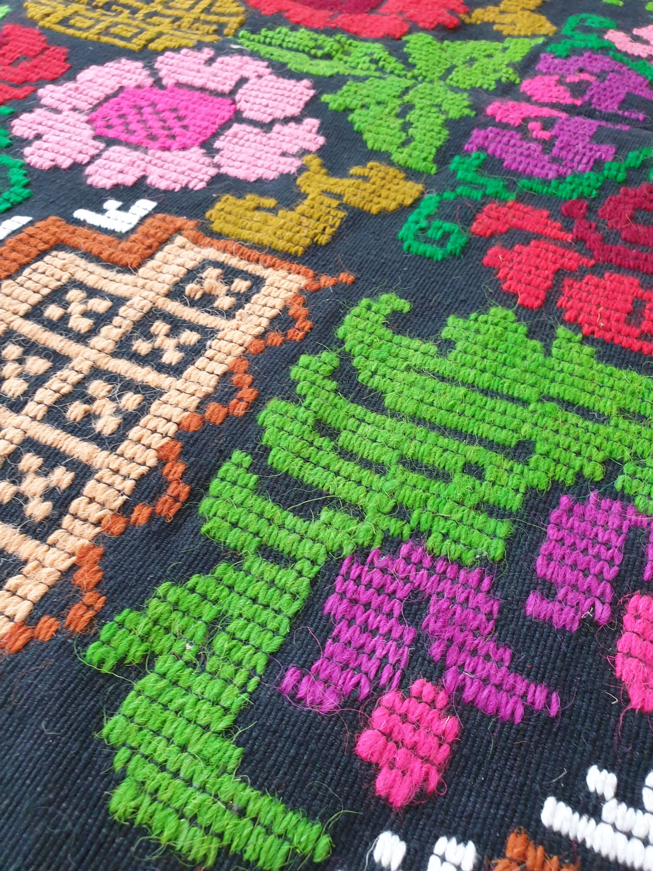 Brown wool rug with colorful boho flowers 142x196cm