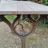 Antique bistro table with iron legs and wooden top