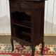 Oak accent furniture bookshelf with a drawer, early 20th century work.