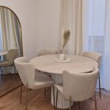 Omega circular dining table in natural travertine