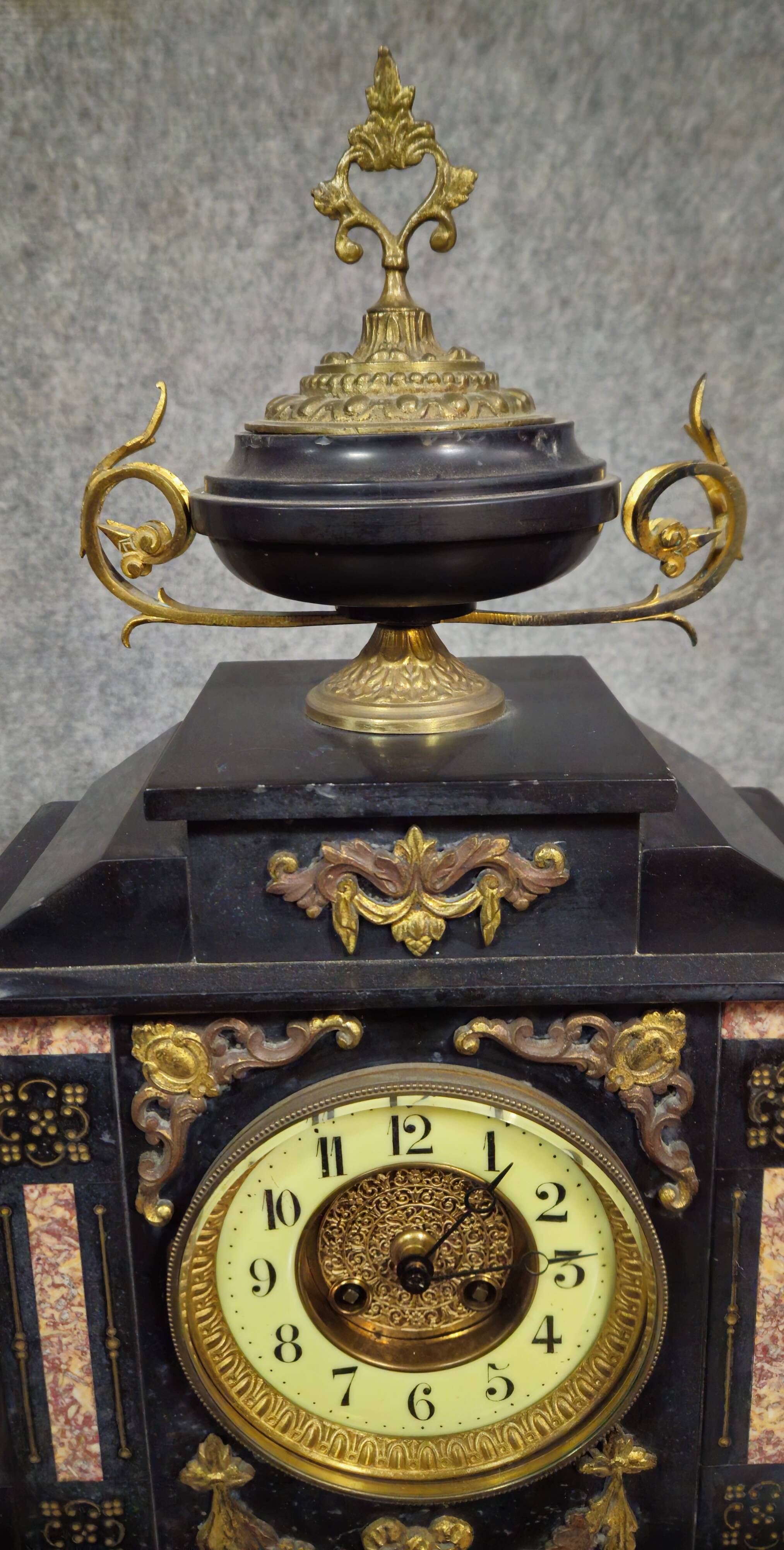 Large notary clock in black marble and gilded bronze.