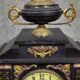Large notary clock in black marble and gilded bronze.