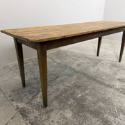 Old farmhouse table with tapered legs, late 19th to early 20th century.