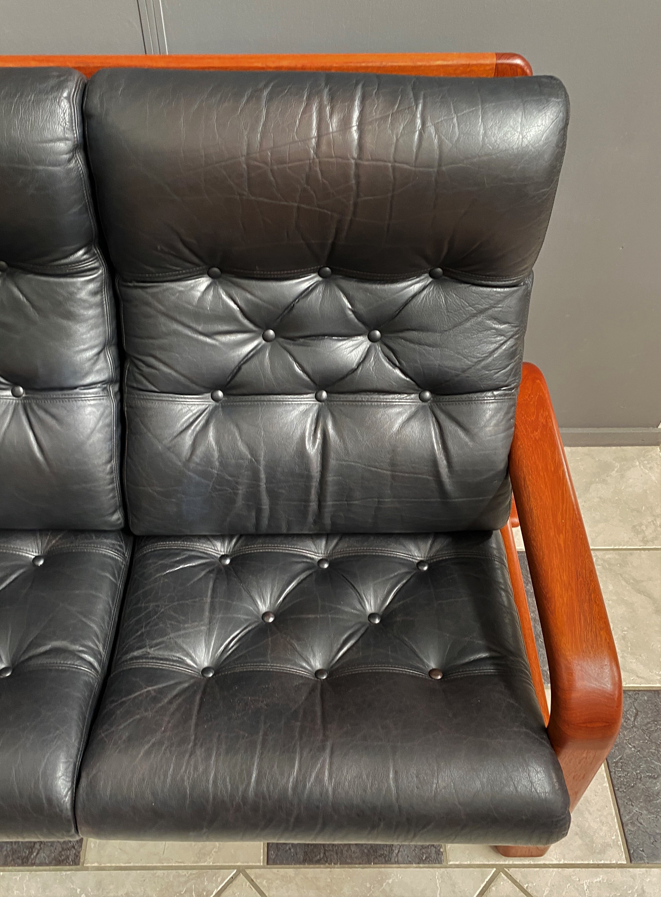 Teak and Black Leather 32 seat sofa by HS Denmark 1970s