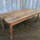 Antique farmhouse table in solid oak with tapered legs and 1 drawer at the end.