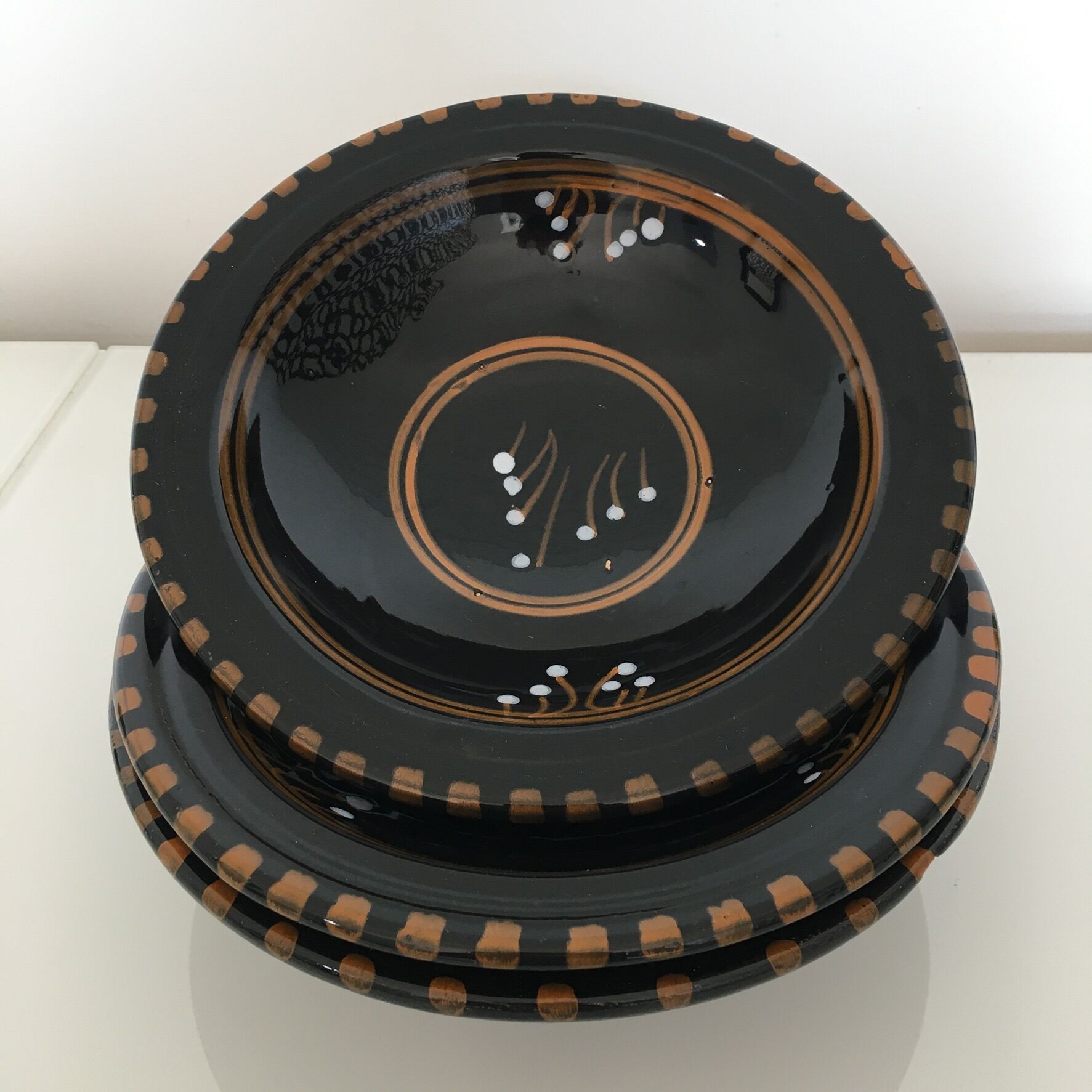 Set of 3 black decorative deep plates.
