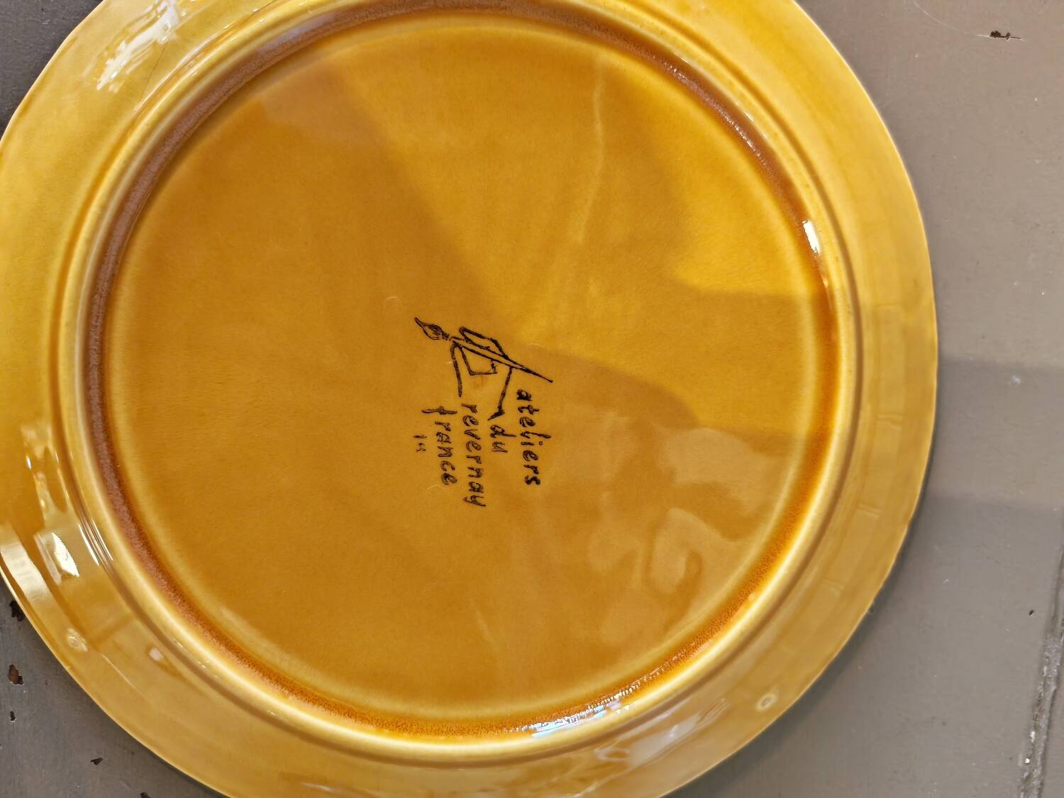 Vintage barbotine plates with fish decoration, 22 pieces.