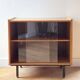 Low buffet or wooden display cabinet with sliding door - 1950s design