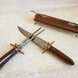 Vintage cutting service with knife and fork in wooden sheath