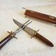 Vintage cutting service with knife and fork in wooden sheath
