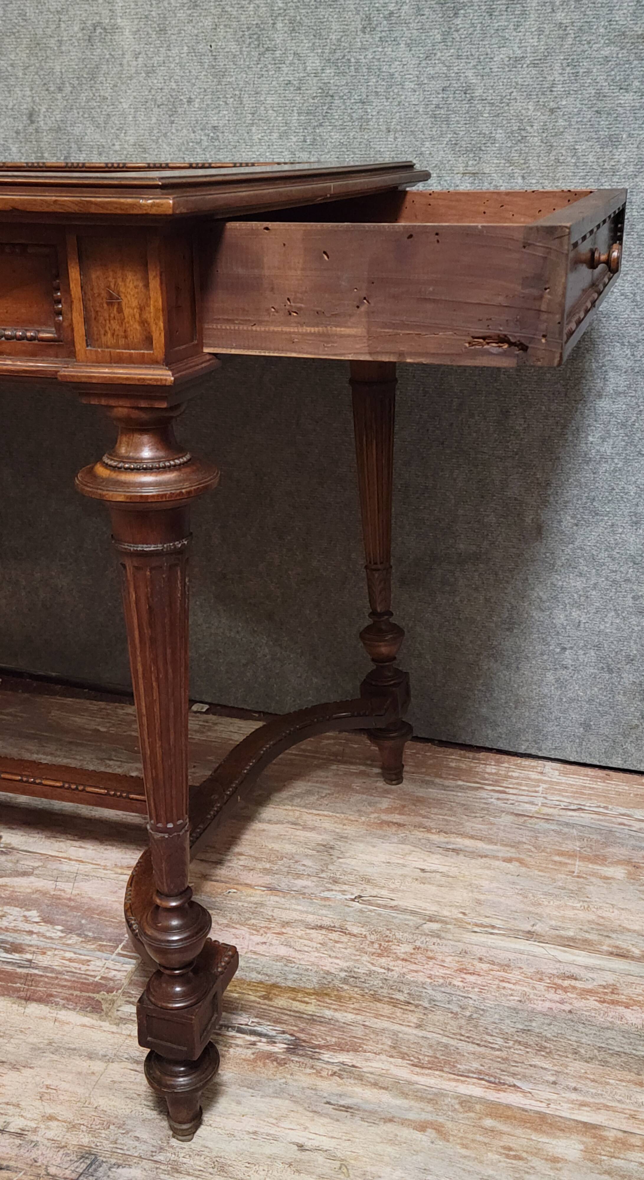 Louis XVI style desk with a curved top, in mahogany.