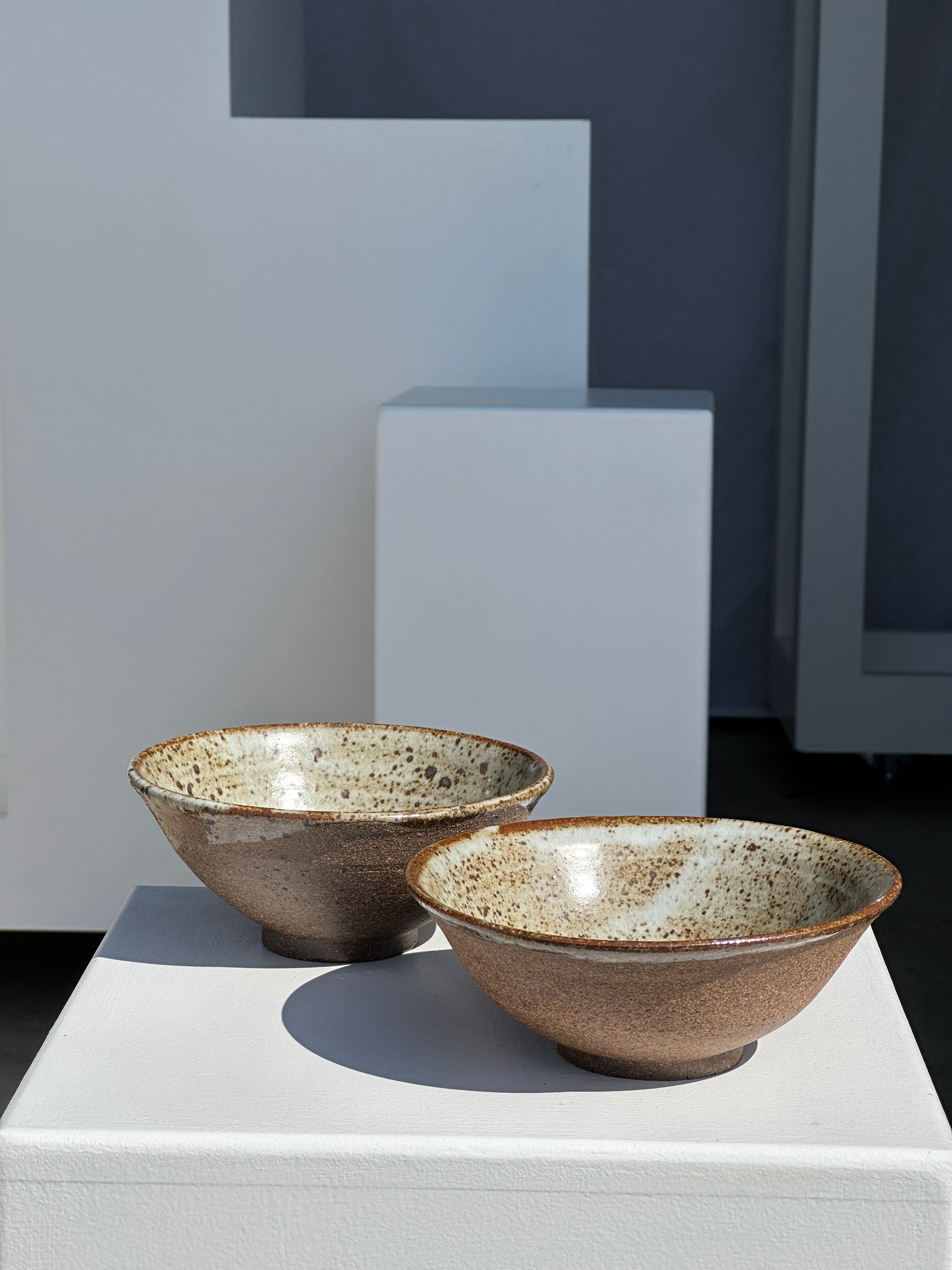 Duo of ceramic bowls interior glazed exterior matt raw earth