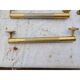 Lot de 12 poignées de portes en laiton art déco