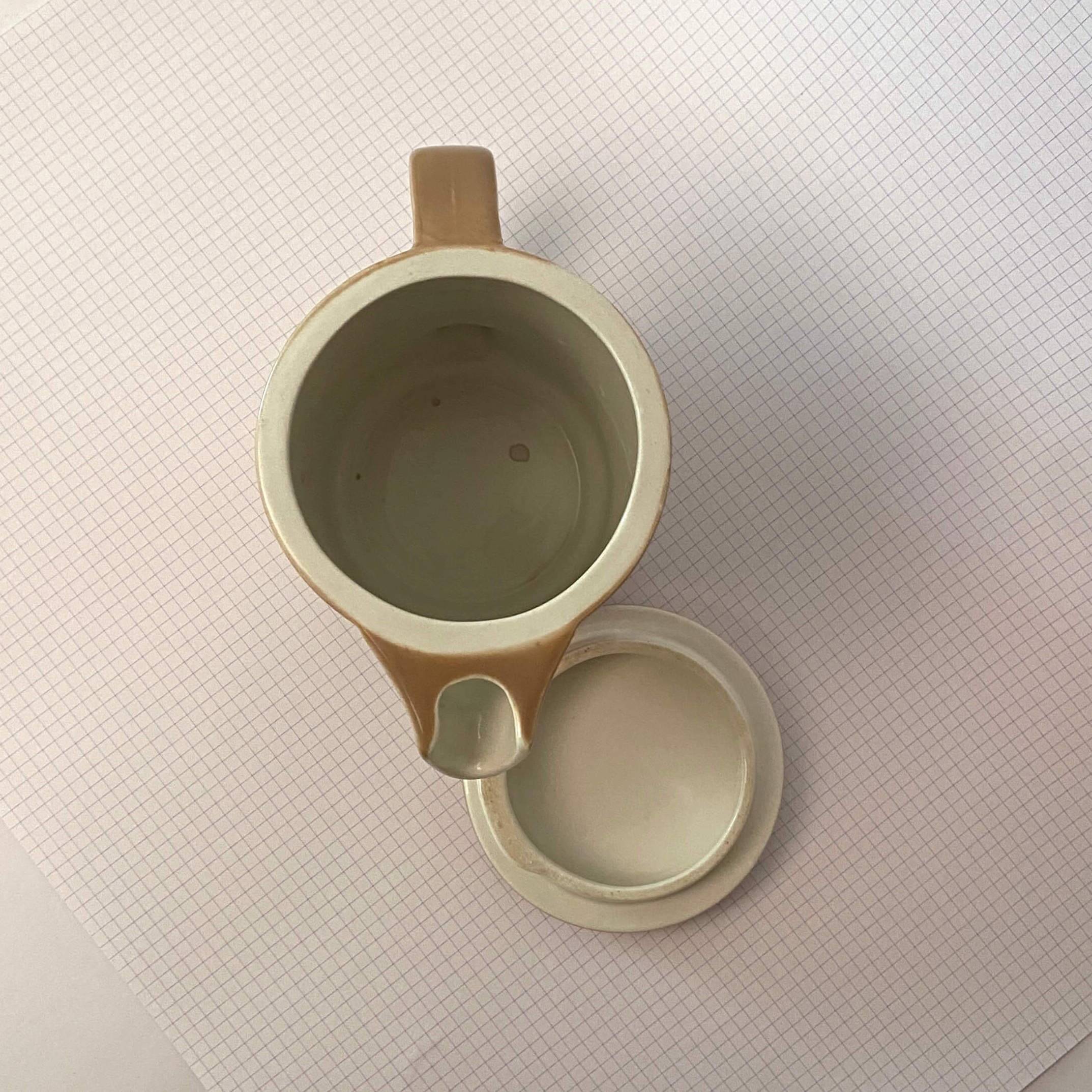 Brown ceramic pitcher