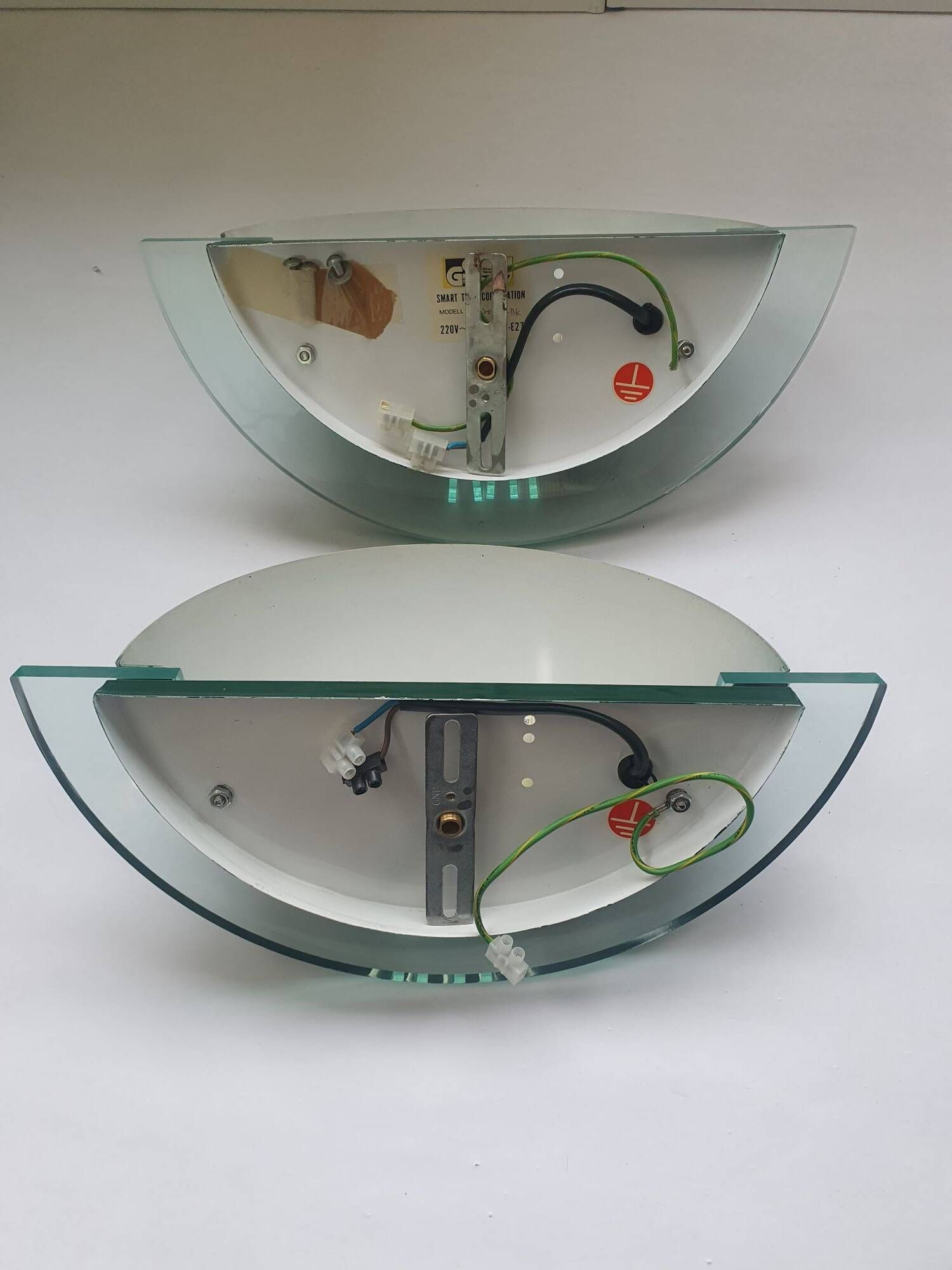 Pair of half-moon wall lights in green metal and plexiglass, 1980s