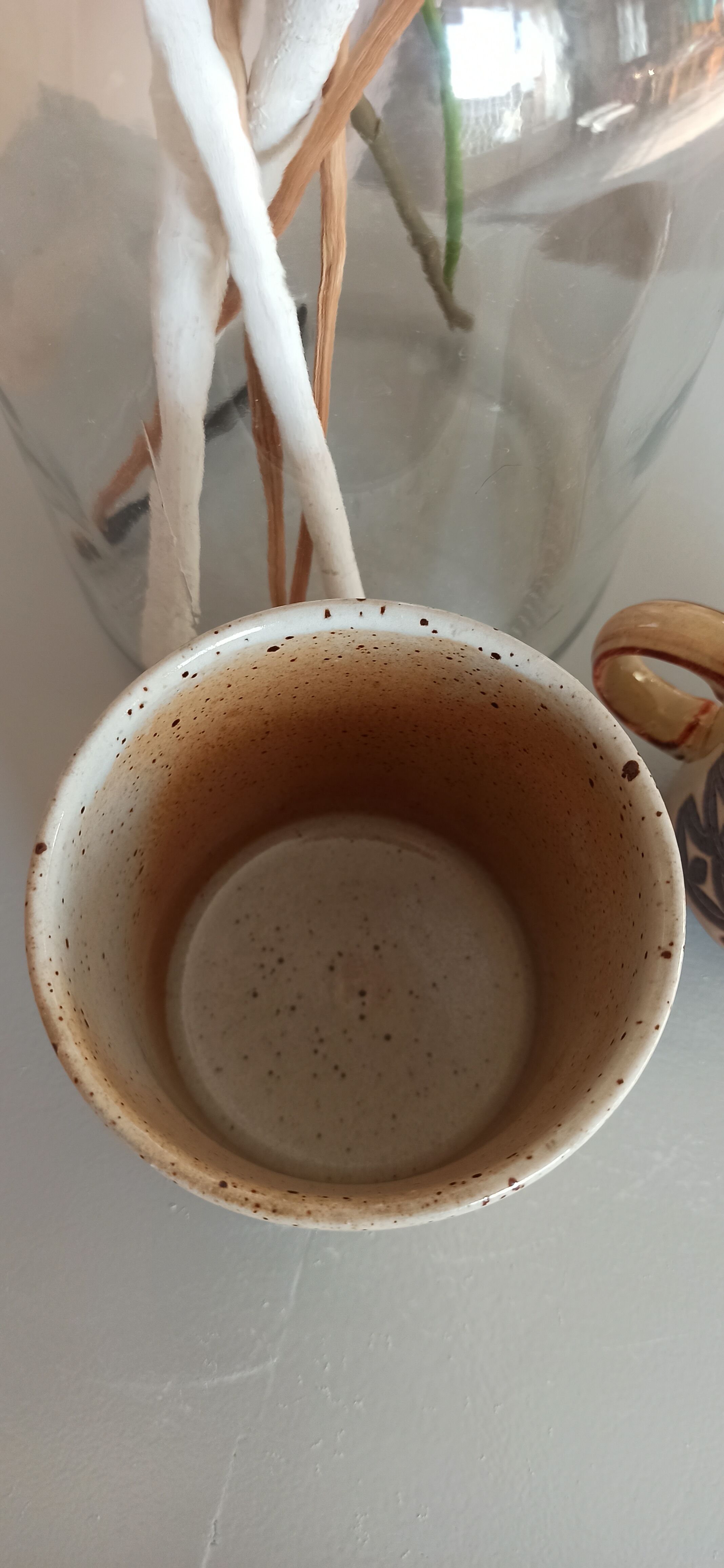 Coffee pot and mug cup in sandstone