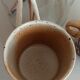 Coffee pot and mug cup in sandstone