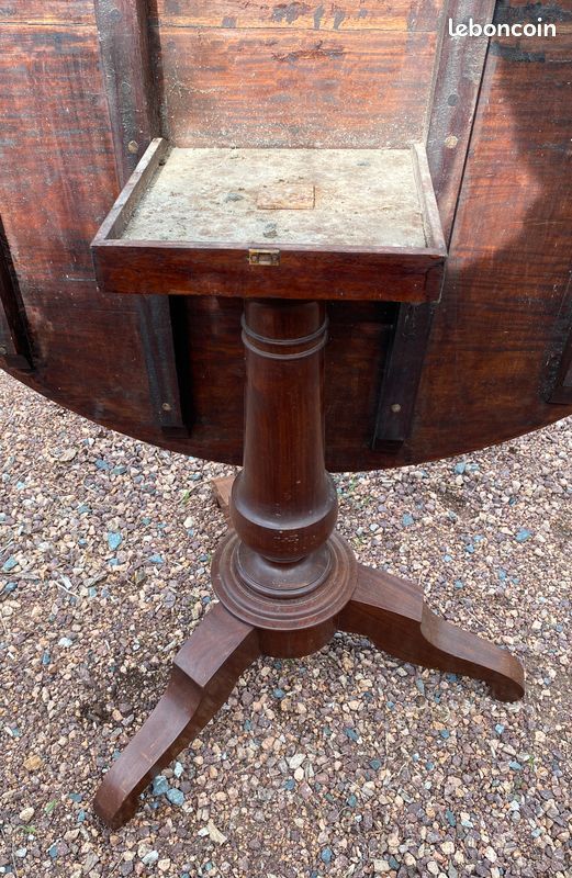 Old and large round winegrower's table made of wood.